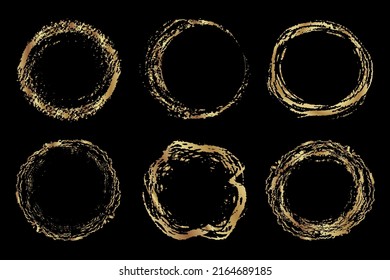 Set of vector golden circle frames made of brush stroke rings.   Isolated brush stroke round shapes on a black background. Grunge style, vector design elements. Use for logo, blank stamp, seal, frame.