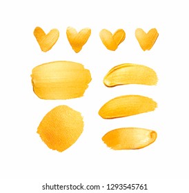 Set of vector golden shining brush strokes and hearts for you amazing design project. Watercolor texture paint stain isolated on white. Abstract hand painted golden background. 