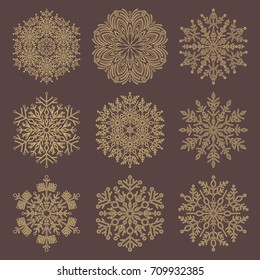Set of vector golden snowflakes. Fine winter ornaments. Snowflakes collection. Snowflakes for backgrounds and designs