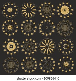 Set of vector golden snowflakes on black background