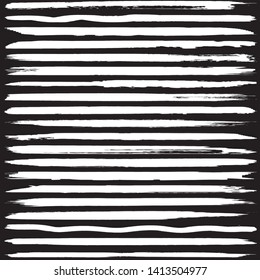 Set of vector grunge brushes. White paint strokes on black background. Abstract handmade lines