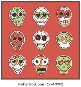Set of vector hand drawn mexican skulls with flowers and hearts.