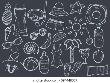 Set of vector hand drawn summer doodles isolated on chalkboard.