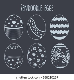 Set of vector hand drawn zendoodle eggs isolated on chalkboard.