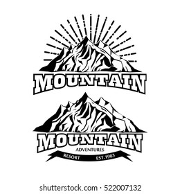 set of vector icon of mountain for logo for mountain adventure with sunburst on the background and ribbon