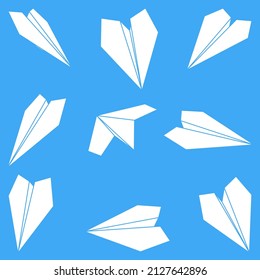 Set of vector illustrations of paper plane icons. Silhouette simple craft paper airplane isolated on blue background. Icon symbol of travel and route.