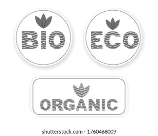 Set of Vector images of badges, stamps, icons with the inscription BIO, ECO, ORGANIC with a pattern of wavy lines and leaves at the top of gray. Logo template on a white background.