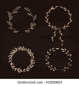 Set of vector laurel wreaths. Vintage designs. Leaves and branches round frames. Hand drawn sketch style.