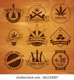 Set of vector marijuana smoking badges. Medical cannabis labels on vintage wooden background