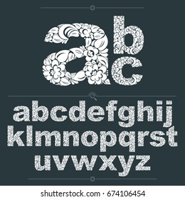 Set of vector ornate lowercase letters, flower-patterned typescript. Black and white characters created using herbal texture.