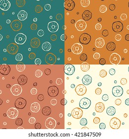 Set of the vector patterns with the hand drawn donuts