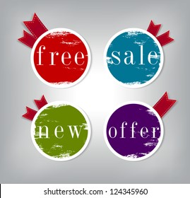 A set of vector round stickers / tags with peeled worn out paint and ribbons