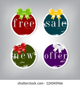 A set of vector round stickers / tags with peeled worn out paint and silky ribbon bow knots