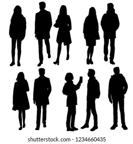 Set of vector silhouettes of men and women in outerwear standing and walking, group of business people. Black color isolated on white background