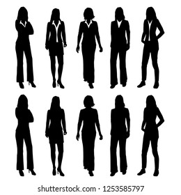 Set of vector silhouettes of women standing in different poses, group of business people in office clothes, black color isolated on white background