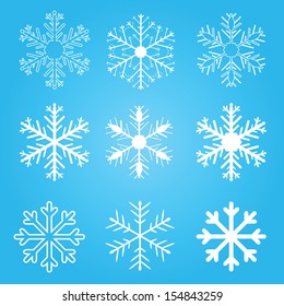 Set of vector snow flakes on blue background