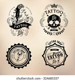 set Vector tattoo studio logo templates on dark background. Cool retro styled vector emblems.