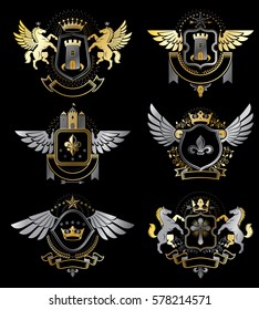 Set of vector vintage emblems created with decorative elements like crowns, stars, bird wings, armory and animals.  Collection of heraldic coat of arms.