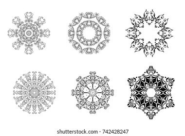 The set of vector vintage snowflakes on white background