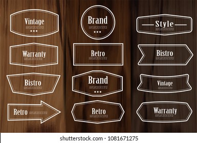 Set of vector vintage style frame labels and elements for design, carve banner on wooden background.