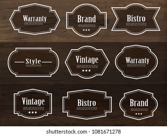 Set of vector vintage style frame labels and elements for design, carve banner on wood texture.