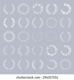 Set of vector white laurel wreaths. Vintage designs. Leaves and branches round frames with shadow.
