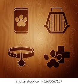 Set Veterinary clinic symbol, Online veterinary clinic symbol, Collar with name tag and Pet carry case on wooden background. Vector