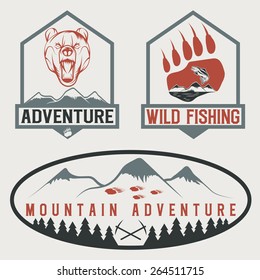 set of vintage adventure labels with bear,salmon and mountains