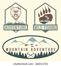 set of vintage adventure labels with bear,salmon and mountains