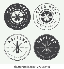 Set of vintage beer and pub logos, labels and emblems with bottles, hops, tires and wheat