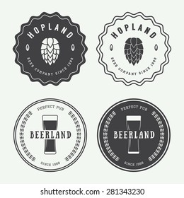 Set of vintage beer and pub logos, labels and emblems with bottles, hops, and wheat