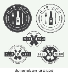 Set of vintage beer and pub logos, labels and emblems with bottles, hops, and wheat
