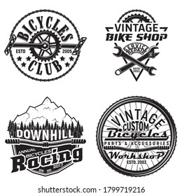 Set of vintage bicycles club logo designs,  downhill bikers grange print stamps, bicycles repair shop creative typography emblems, Vector