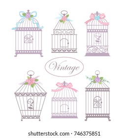 Set with vintage bird cages decorated with flowers and ribbons. Hand drawn vector illustration for greeting card, invitation, banner, scrapbooking.