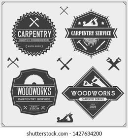 Set of vintage carpentry emblems. Woodwork  labels, badges, logos and design elements. Black and white vector illustration.