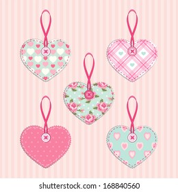 Set of vintage fabric handmade hearts with ribbon and button in shabby chic style for Valentines day