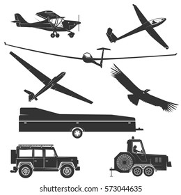 Set of vintage gliding elements and equipment. Vector illustration. Set include glider winches, eagle, gliding trailer, airplane and glider plane silhouette.