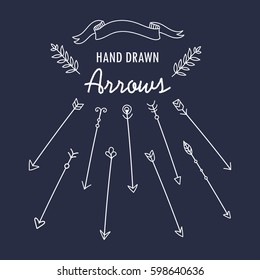 Set of vintage hand drawn arrows on the chalkboard background. 