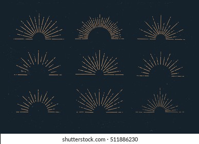 Set of vintage hand drawn sunbursts on dark background. Starburst, sunrays. Design elements.