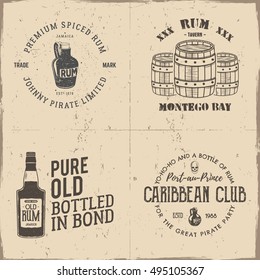 Set of vintage handcrafted pirates emblems, labels, logos. Isolated on a scratched paper background. Sketching filled style. Pirate and sea symbols - old rum bottles, barrels, skull. Vector.