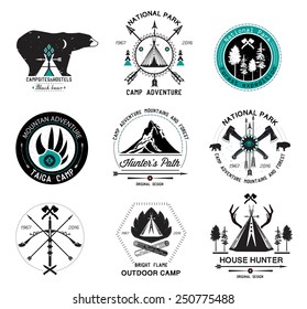 Set of vintage hunting labels. Set mountain hunting labels and design elements. Outdoor camp logo. Design elements for hunting. Wildlife sign. Indian wigwam logo. Crossed. Axes, bow, arrows logo.