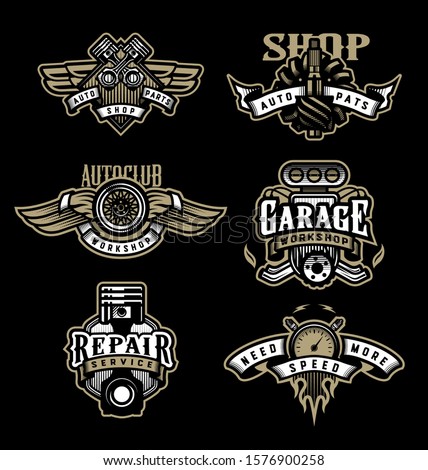 Set of vintage monochrome auto emblems, badges, logos on a dark background.