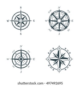 Set of vintage or old different style like globe and arrows compasses for west and east, north and south navigation. Perfect for marine and nautical, ship and topography, maritime theme