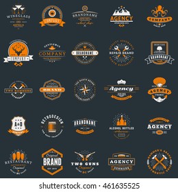 Set of vintage retro logotype templates. Collection of 25 items. Vector logo design elements. Icon symbols. Labels. Badges. White and orange colors on dark background