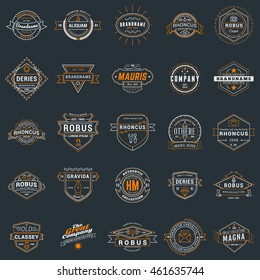 Set of vintage retro logotype templates. Collection of 25 items. Vector logo design elements. Icon symbols. Labels. Badges. White and orange colors on dark background