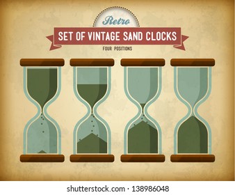 Set of vintage sand clocks on grungy card