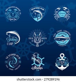 Set of vintage seafood logos with fish, crab, lobster, shrimp, anchor, helm and sunburst on blue background