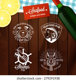 Set of vintage seafood logos with fish, crab, lobster, shrimp, anchor and sunburst on wood background with realistic lemons and bottle of wine