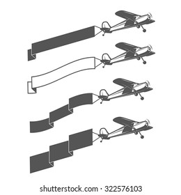 Set of vintage small aircraft dragging blank ribbon