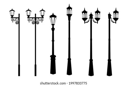 A set of vintage street lights. Silhouette of a street lamp, a lantern with a forged lattice, black and white color, isolated on a white background